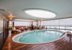 a large pool in the middle of a hotel room at Hillary Nature Resort & Spa All Inclusive in Arenillas