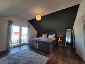 Cama o camas de una habitación en Ferienhaus Alexandra