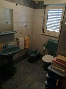 Ванная комната в Apartmani Bosko Baraban