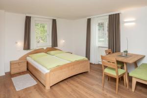Postel nebo postele na pokoji v ubytování Residence Haus Heinrich