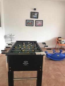 a room with a pool table with balls on it at Cherry Blossom Homestay in Kodaikānāl