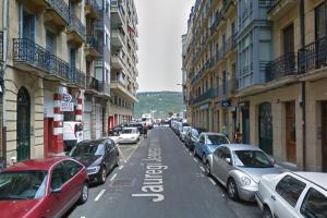 a city street with cars parked on the street at Casa Naranja - Centrally located, spacious, unique in Donostia-San Sebastián