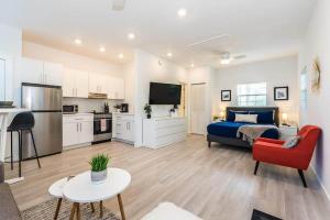 a living room with a bed and a kitchen and a room at The Studio at Old Mission Walking Distance to Downtown and Onsite Parking in Saint Augustine