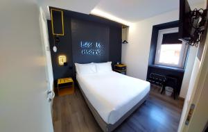 En eller flere senger på et rom på Hotel Aurora Duino