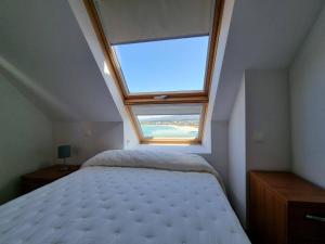 מיטה או מיטות בחדר ב-Mirador al Cantabrico