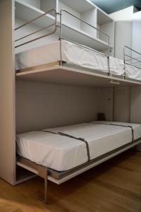Letto o letti in una camera di Alpi Azzurre