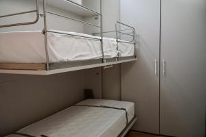 Letto o letti in una camera di Alpi Azzurre