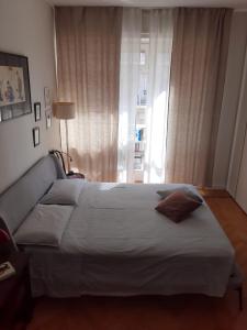 Postel nebo postele na pokoji v ubytování Stanza con bagno privato a 10 minuti da Eurovision Song Contest