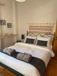 a bedroom with a large bed with two pillows on it at Evergreen Elati in Elati Trikalon