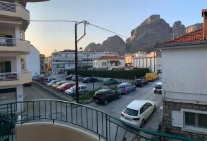 a view of a parking lot with a mountain in the background at Divine Meteora Luxury midtown apartment in Kalabaka