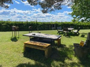 a picnic table in the grass in a field at Toila Pikk Apartment in Toila