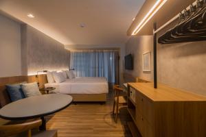 Postel nebo postele na pokoji v ubytování Hotel Luzeiros Fortaleza