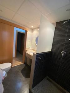 a bathroom with a toilet and a sink at Cala del Mar Apartment - La Cala de Mijas in La Cala de Mijas +11 photos