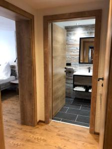 a bathroom with a sink and a mirror at Ferienhof-Oberer-Gollmitzer-2-5-km-oberhalb-von-Heiligenblut-ruhige-sonnige-Lage-Glocknerblick in Heiligenblut