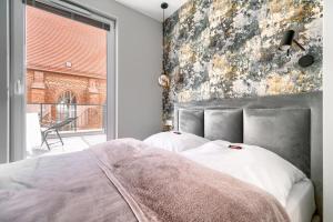 Posteľ alebo postele v izbe v ubytovaní Apartament 1000 Stare Miasto bulwary Apartamenty No 1