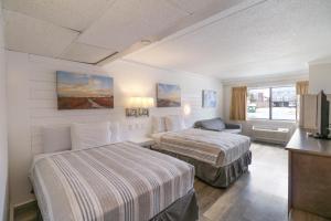 Atlantic Oceanside Dewey客房内的一张或多张床位