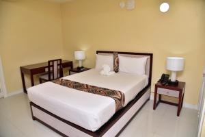 Lova arba lovos apgyvendinimo įstaigoje Hotel Grand A View