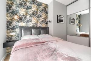 Posteľ alebo postele v izbe v ubytovaní Apartament 1000 Stare Miasto bulwary Apartamenty No 1