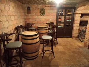 a room with a bunch of barrels in a bar at Robinson Vila Kitokret in Kutjevo
