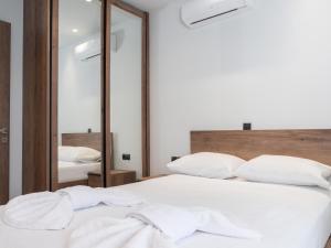Posteľ alebo postele v izbe v ubytovaní Apartment Lazarous 3