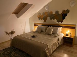 a bedroom with a large bed in a room at Studio & Sunrise Nida in Nida