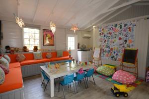 a living room with a table and a couch at Sugar Bay Barbados - All Inclusive in Bridgetown
