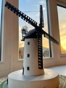 a model of a windmill on top of a cake at Avondale, Lytham - Unique and luxury apartment in the heart of Lytham in Lytham St Annes