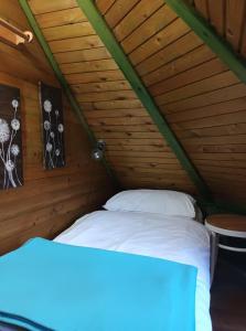 Tempat tidur dalam kamar di Robinson Vila Kitokret