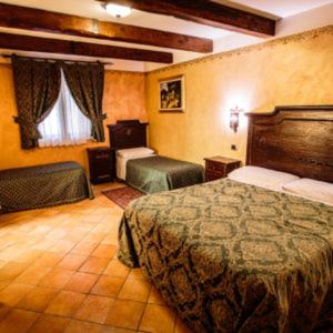 a hotel room with two beds in a room at Hotel Guerrinuccio in Celano