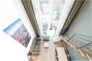a view from the top of a building with large windows at TopFloor Apartments in Vilnius