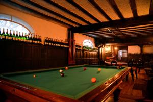a pool table with balls on it in a room at Mansión Papilio in Mexico City
