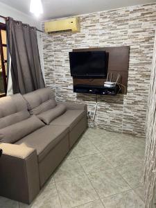 TV a/nebo společenská místnost v ubytování Cantinho da Nat Arraial