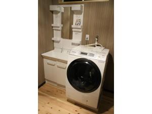 a washing machine in a kitchen next to a counter at Kishida House - Vacation STAY 36589v in Nagahama