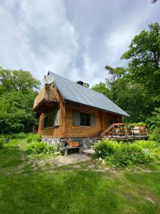 a log cabin with a metal roof at Wooden house in the nature in Modra