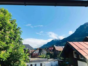 a view of a town with mountains in the background at Ferienwohnung im Herzen von Oberstdorf in Oberstdorf