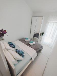 Ένα ή περισσότερα κρεβάτια σε δωμάτιο στο Apartment Garden, Korcula