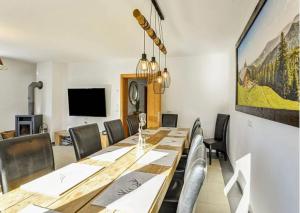 A television and/or entertainment centre at Alm'a Residence