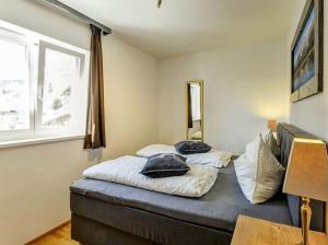 A bed or beds in a room at Alm'a Residence