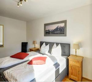 A bed or beds in a room at Alm'a Residence