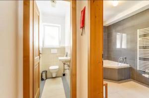 A bathroom at Alm'a Residence