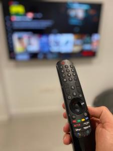 Telewizja i/lub zestaw kina domowego w obiekcie Apartment Andrea in Malaga Center