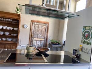 a kitchen with a counter top with a bowl on it at Gîte La Cure in Noduwez +119 photos
