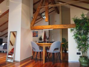 a dining room with a wooden table and chairs at GreatStay - with free parking in center in Pula