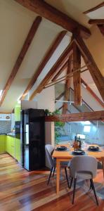 a kitchen with a table and chairs and a refrigerator at GreatStay - with free parking in center in Pula