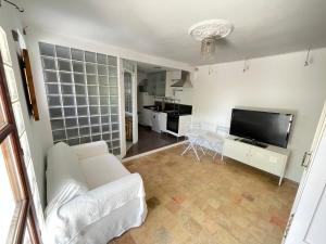 Televízia a/alebo spoločenská miestnosť v ubytovaní Casita rosa