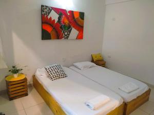 Postel nebo postele na pokoji v ubytování RokaDura Hotel