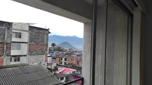a view from a window of a city at APARTAMENTO CÓMODO, ILUMINADO Y CENTRAL EN MANIZALES in Manizales