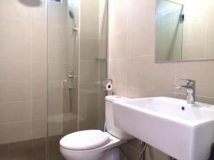 a bathroom with a toilet and a sink and a shower at Golden House-Atlantis Residence in Malacca +60 photos