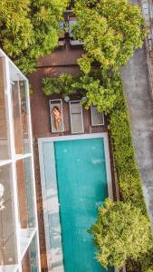 an overhead view of a swimming pool with trees at POR Thapae Gate in Chiang Mai