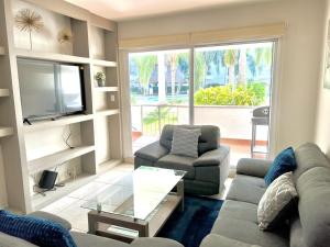 TV a/nebo společenská místnost v ubytování COSTA VELEROS MARINA MAZATLAN 101